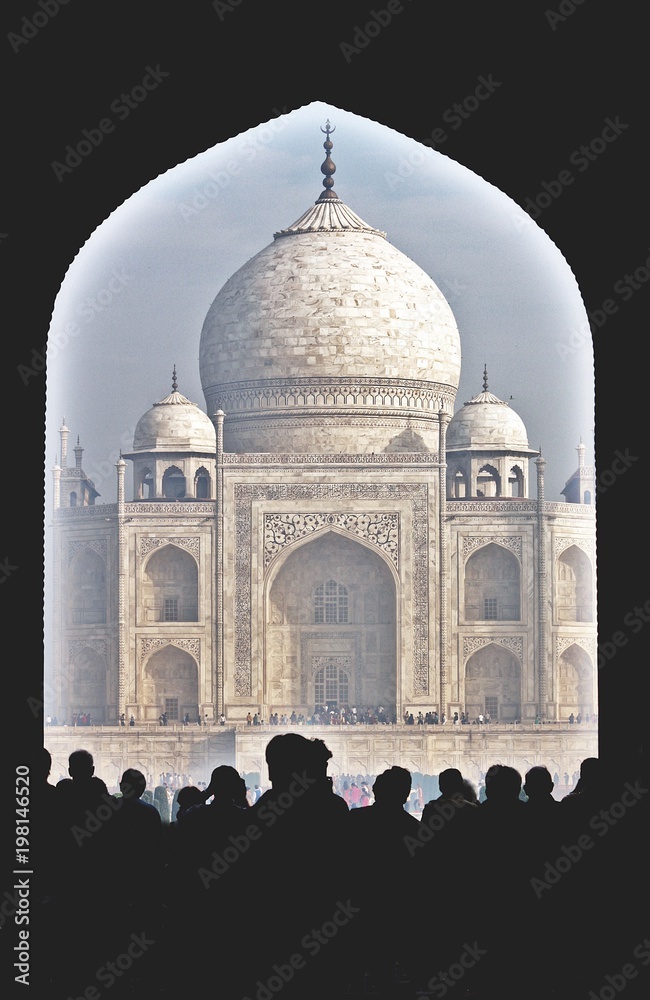 Taj Mahal. India. Agra. An immense mausoleum of white marble on the south bank of the Yamuna river. One of the seven wonders of the world. The view from the front through the passage.