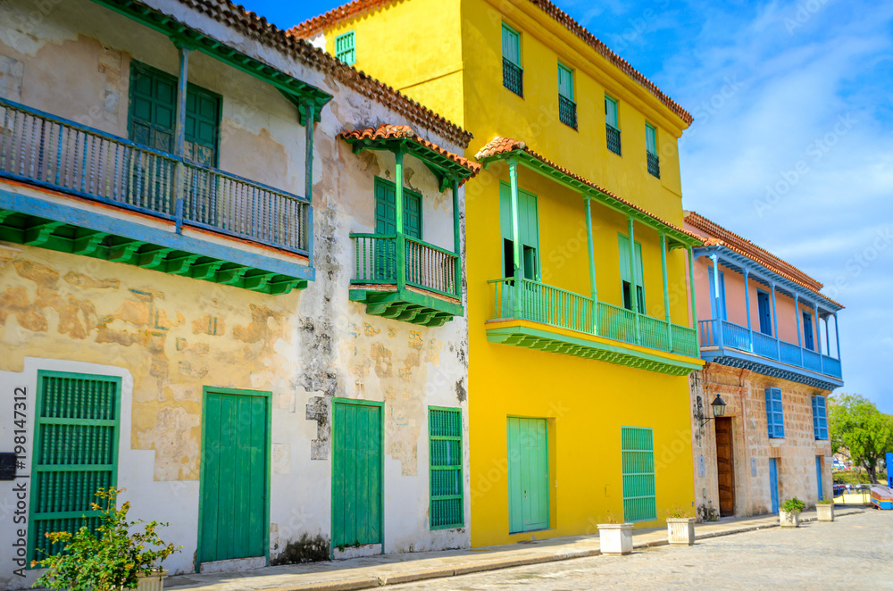 bright, saturated fosada houses in Cuban cities, on a bright sunny day