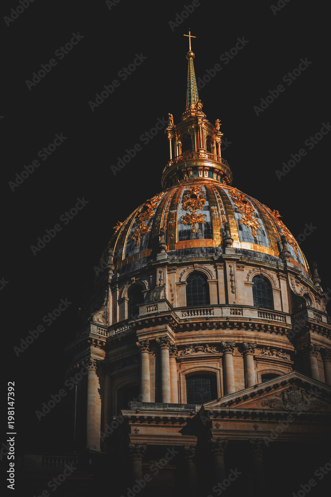 Low-angle view of Les Invalides dome at night