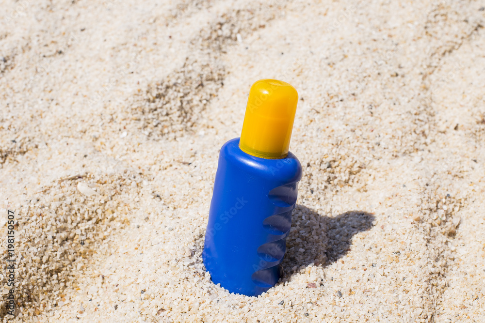 Summer holiday - suntan oil on beach Summer holiday - suntan oil on beach