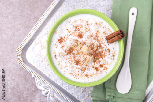 Brazilian winter festival dessert Canjica. White corn porridge photo