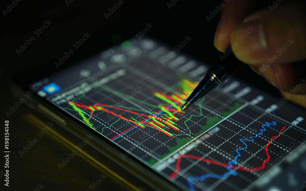 Businessman analyzing stock market chart on smartphone