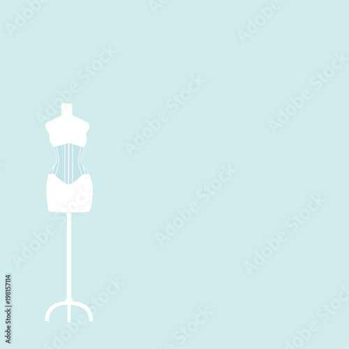 light mannequin with corset on a light blue background