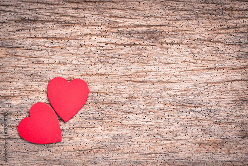 Red heart made from wood on wooden background