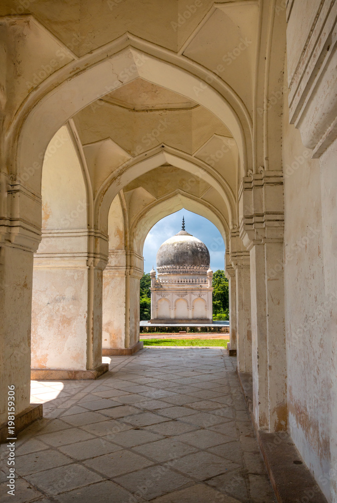 View of the Qutb Shai tombs in Hyderabad viewed from a corridor