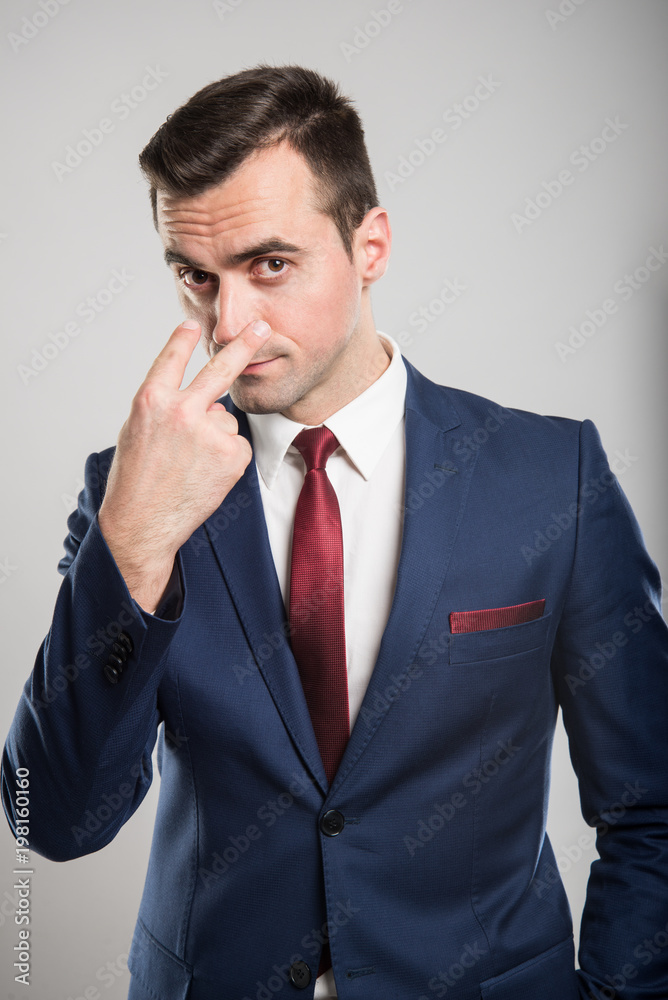 Attractive business man making watching you gesture Attractive business man making watching you gesture