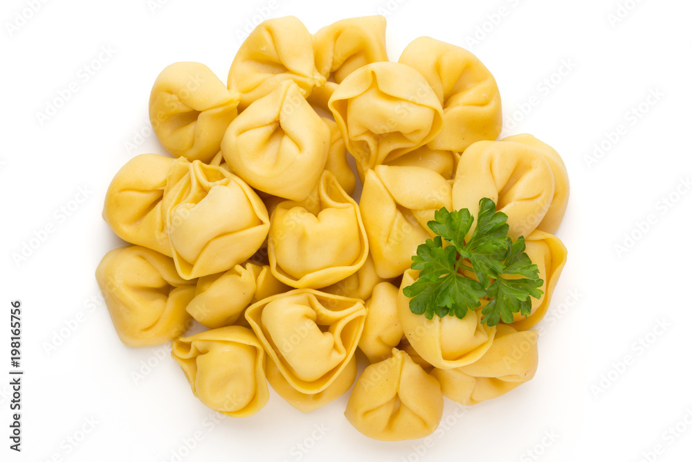 Raw homemade pasta,tortellini with herbs. Raw homemade pasta,tortellini with herbs.