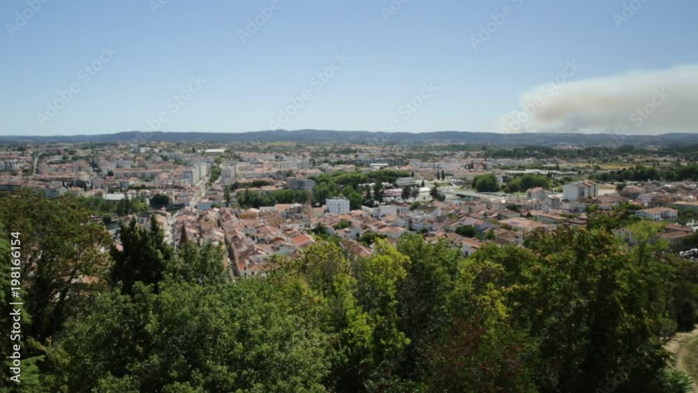 Aerial view of Tomar from Tomar Castle, Portugal, Europe. Tomar city skyline with Praca da Republica, the main square with Town Hall and Church of Saint John the Baptist. Aerial view of Tomar from Tomar Castle, Portugal, Europe. Tomar city skyline with Praca da Republica, the main square with Town Hall and Church of Saint John the Baptist.