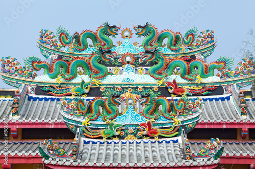 Chinese dragon statue on the roof of the Chinese temple in Thailand