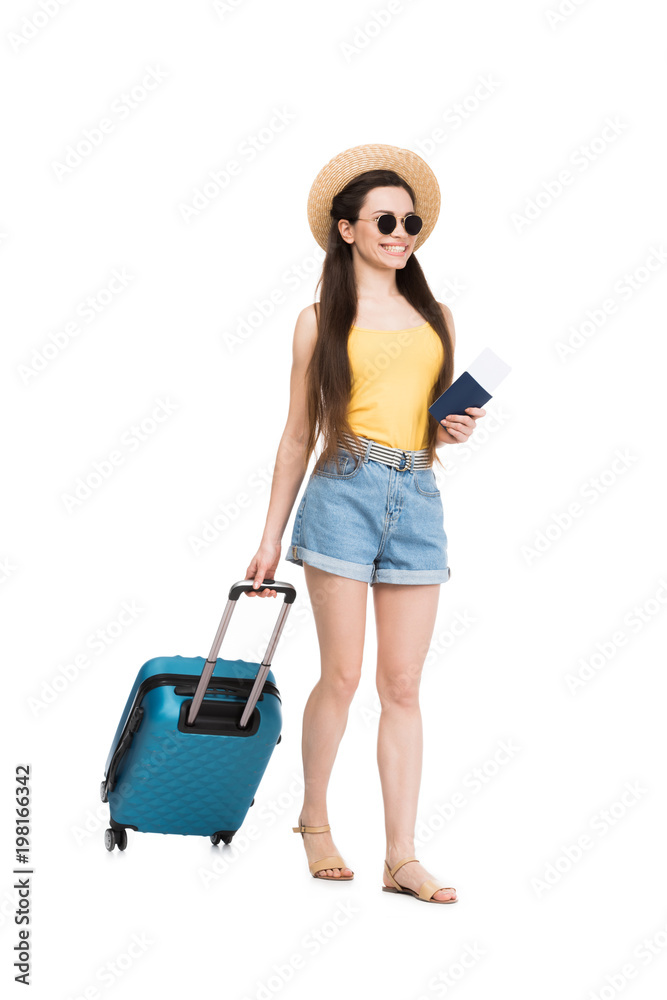 smiling female traveler with passport, air ticket and baggage, isolated on white smiling female traveler with passport, air ticket and baggage, isolated on white