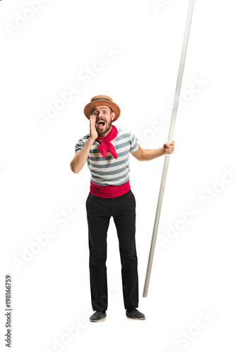 Фотография Caucasian man in traditional gondolier costume and hat