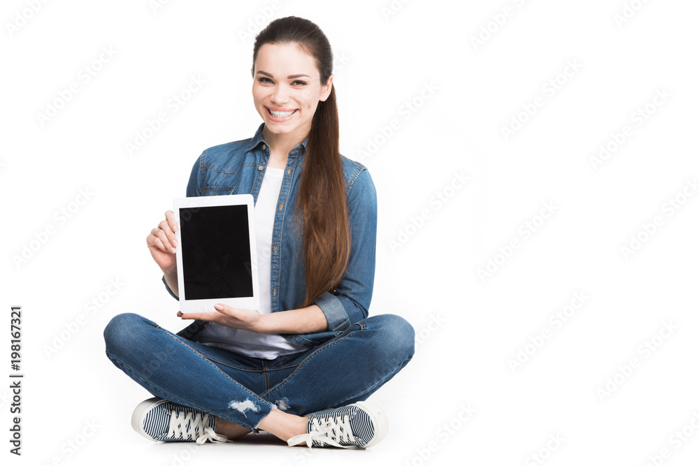 attractive smiling woman showing tablet with blank screen, isolated on white