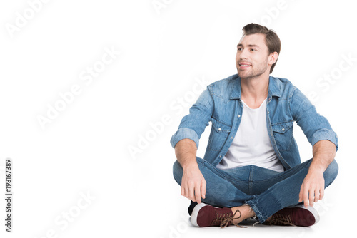 handsome smiling man in denim, isolated on white