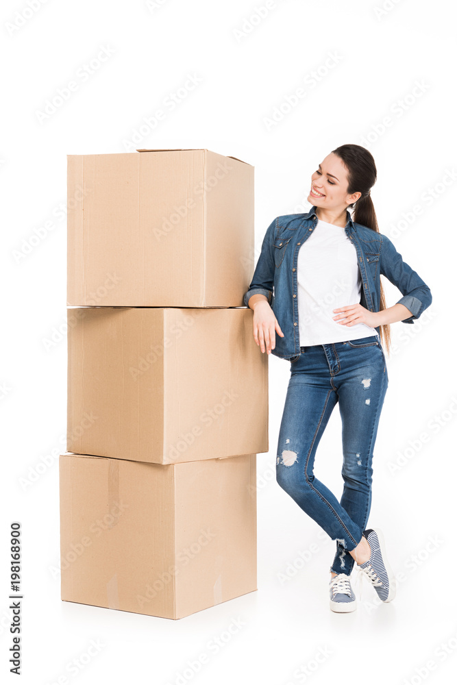 young woman moving with carton boxes, isolated on white young woman moving with carton boxes, isolated on white