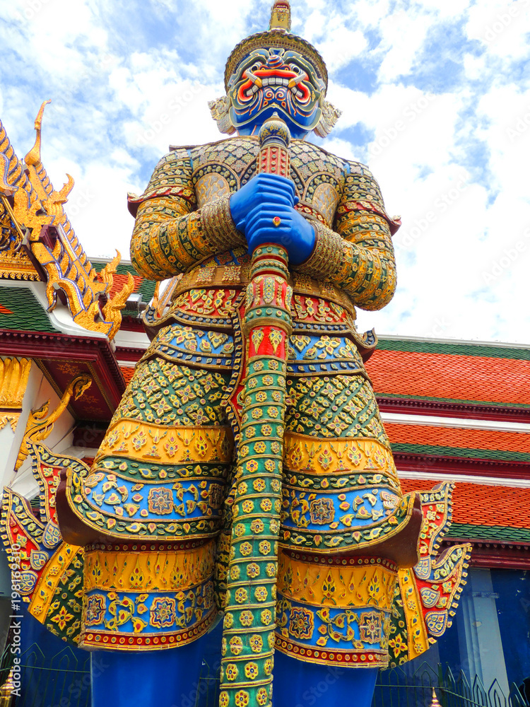 Statue of a giant Thai standing in the Emerald Buddha, Bangkok, Thailand.