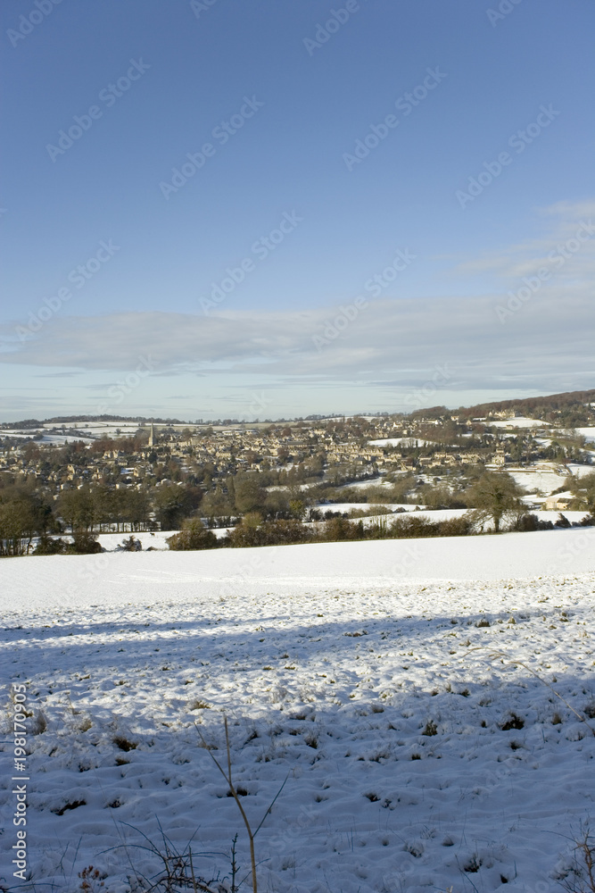 Winter sunshine on Painswick in snow, Gloucestershire, Cotswolds, UK