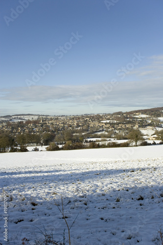 Winter sunshine on Painswick in snow, Gloucestershire, Cotswolds, UK