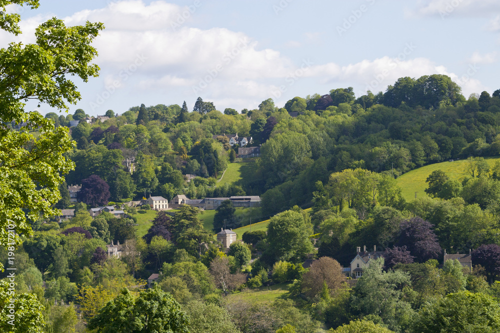 Homes on the wooded valley hillsides near Stroud, Gloucestershire, UK