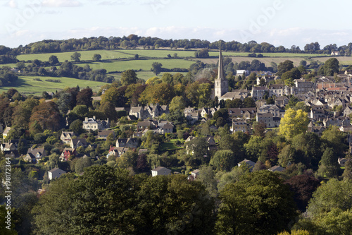 First signs of Autumn colour in the trees around the picturesque Cotswold village of Painswick  Gloucestershire  UK