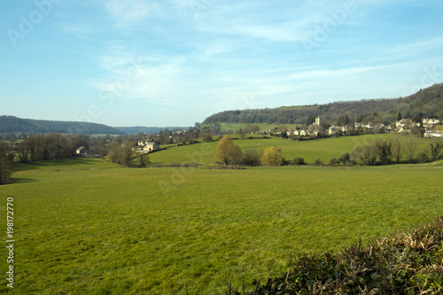 Picturesque Uley village on the edge of the Cotswold Hills escarpment in spring sunshine  Gloucestershire  UK.