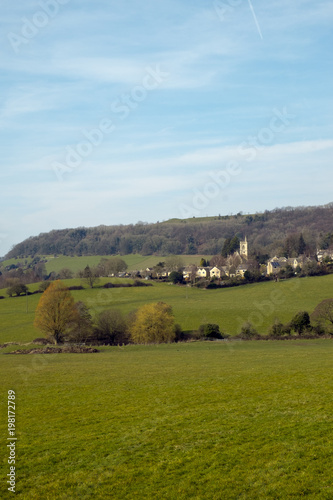 Picturesque Uley village on the edge of the Cotswold Hills escarpment in spring sunshine, Gloucestershire, UK.