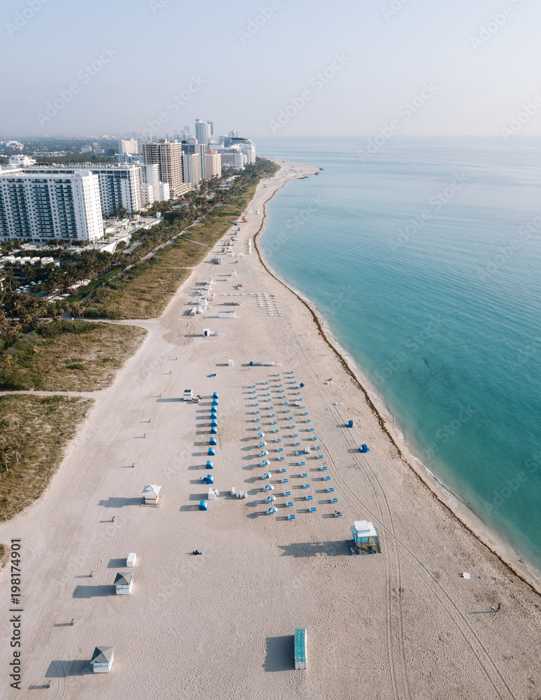 Obraz premium Aerial view of sandy beach with sun loungers, Miami Beach, Florida, USA