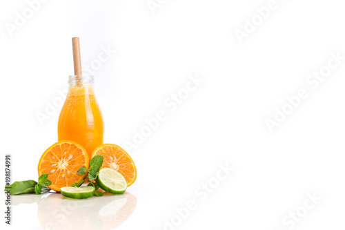 Orange fruit juice isolated on white background with cut fruit and copy space.