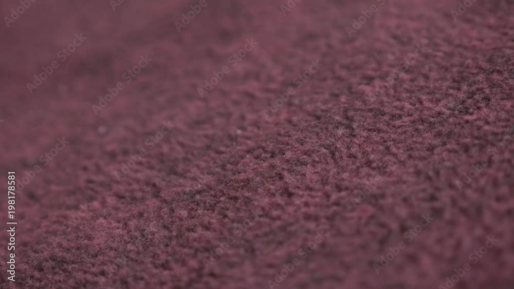 Vidéo Stock Shallow DOF maroon polar cloth texture slow pan footage ...