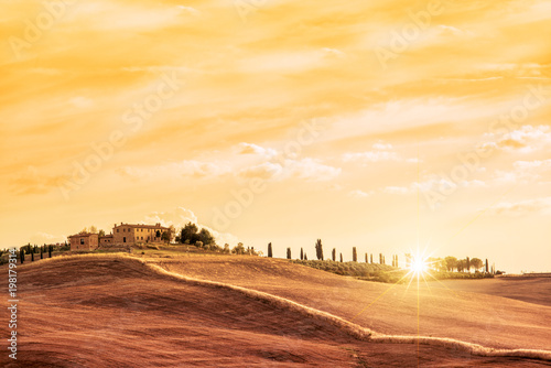 Beautiful typical landscape of Tuscany at sunset, Italy