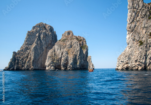 Fototapeta Naklejka Na Ścianę i Meble -  View from the boat on the Faraglioni Rocks on Capri Island, Italy.
