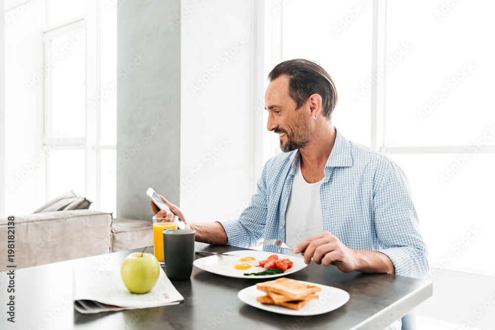 Happy mature man using mobile phone Happy mature man using mobile phone