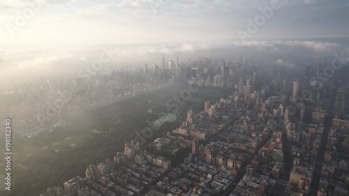 New York City aerial view of Manhattan from the Upper West Side and Central Park, with fog and low level clouds over Midtown at sunrise. photo