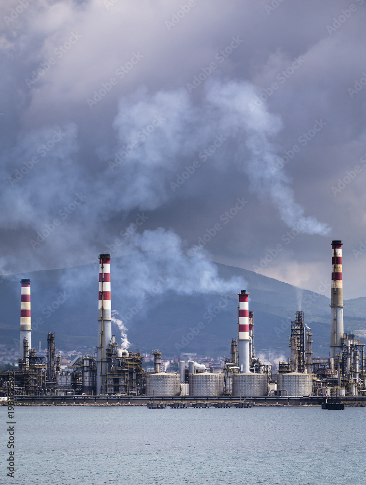 Heavy smoke over an oil refinery