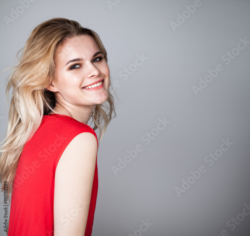 Beautiful Woman Laughing on Gray Background