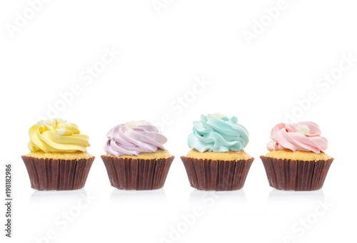macro close up of four cupcakes with cream and sugar isolated on white background, File contains a clipping path