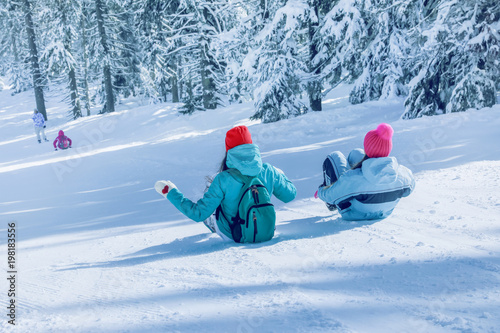 Happy women sliding down th...