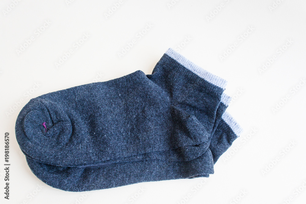 Gray socks on a light background. Candid, copy space. Gray socks on a light background. Candid, copy space.