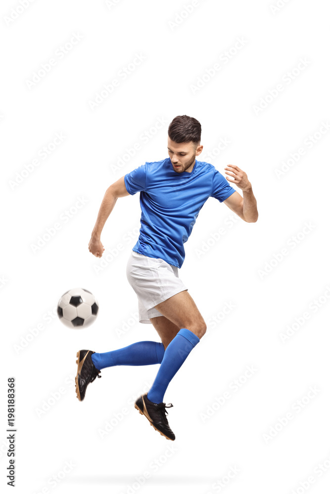 Soccer player doing a trick with a football