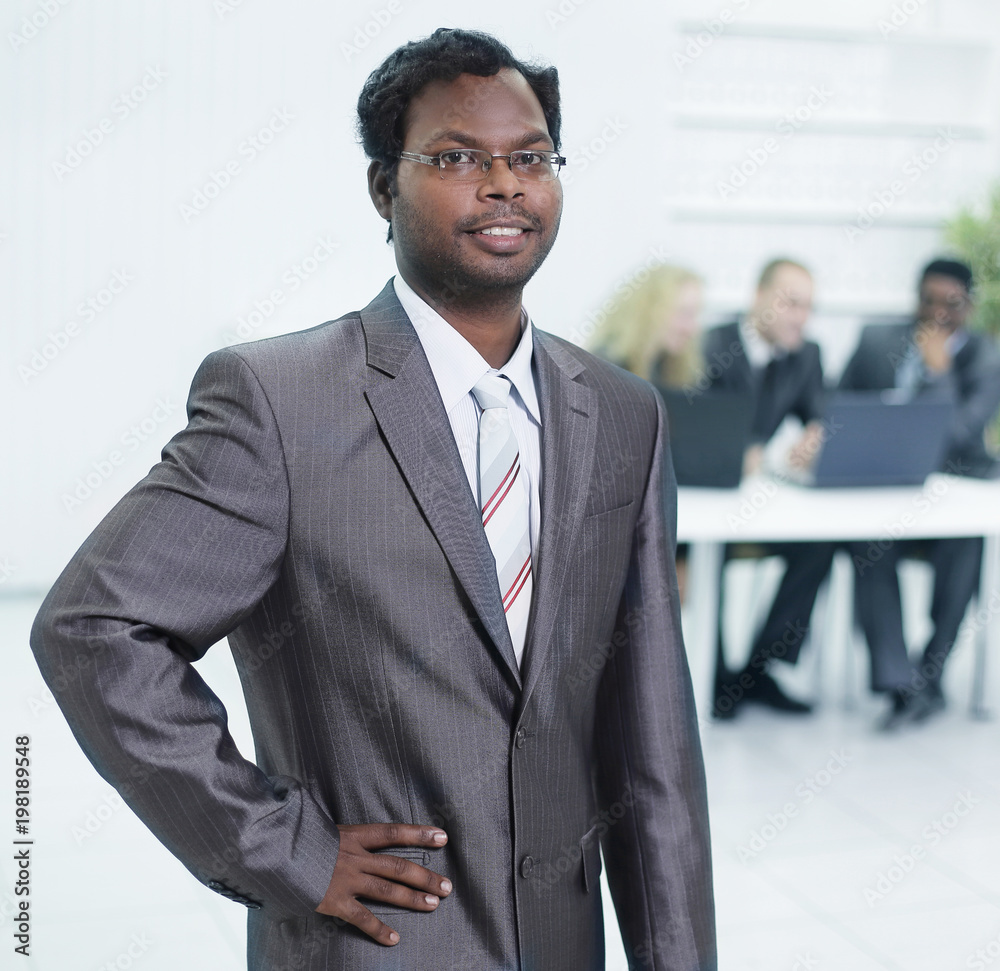 portrait of a successful employee in the background of the office portrait of a successful employee in the background of the office