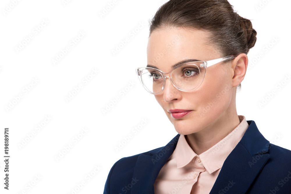close-up portrait of adult businesswoman in stylish eyeglasses looking away isolated on white