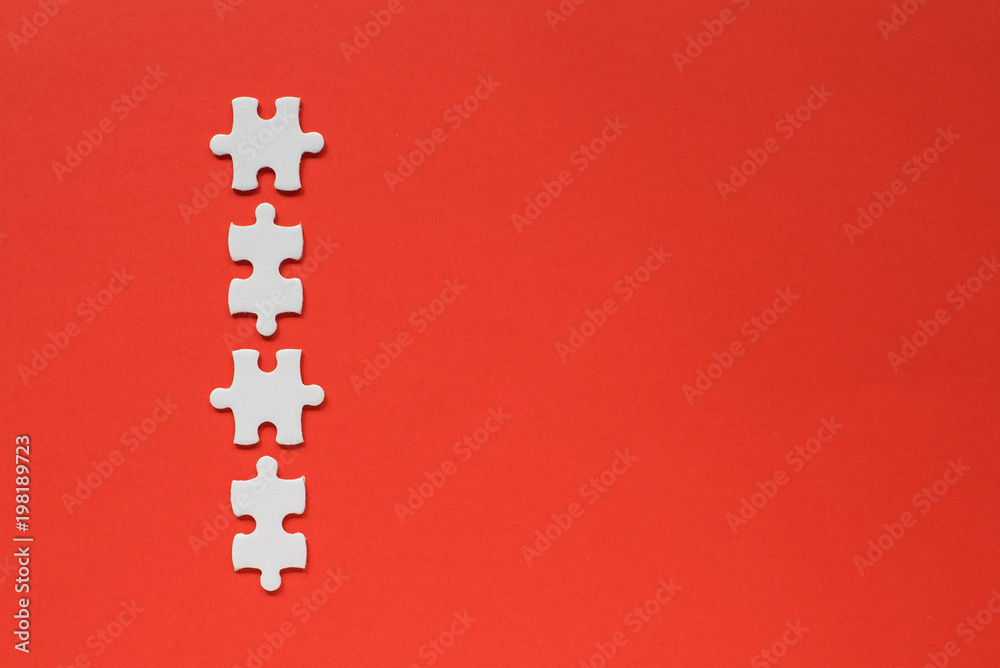 four white details of puzzle on red background four white details of puzzle on red background