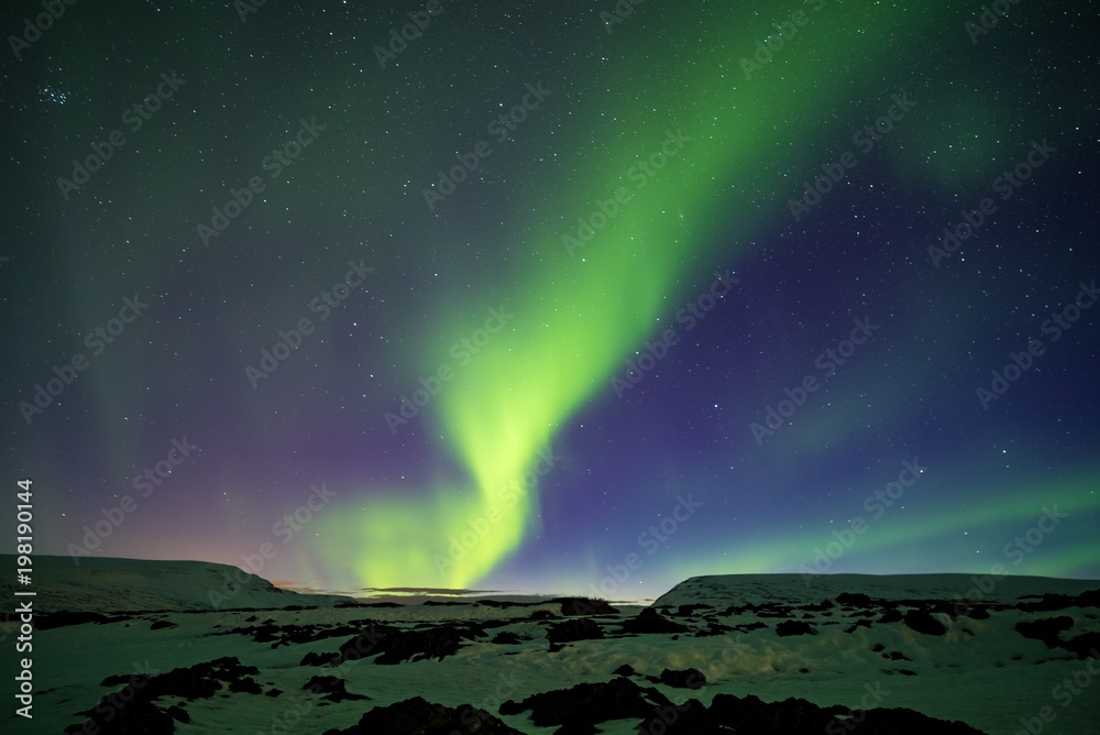 Aurora borealis on a mountain near the Godafoss in Iceland 1