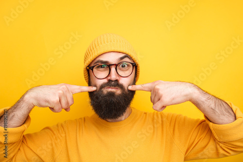 Papier peint Grimacing hipster making faces at camera