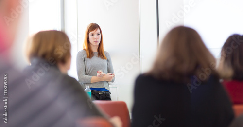 Εκτύπωση καμβά Confident smart female doctoral student presenting his study work in front of professors's choir, defending his thesis