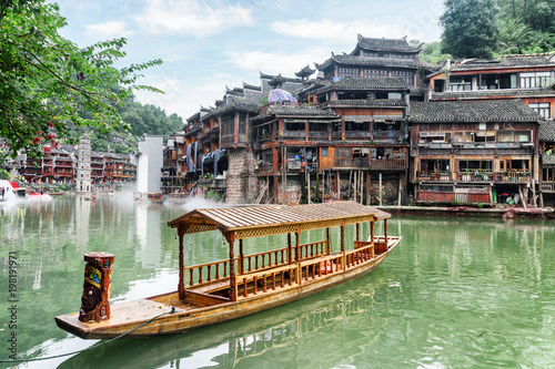 Scenic view of parked wooden boat on the Tuojiang River photo