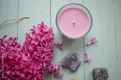 bright crimson hyacinths with crystals of amethyst on the table
