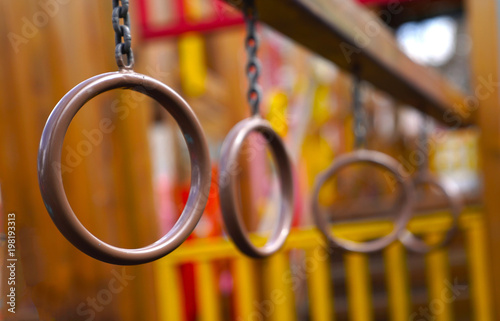 Iron ring chain for exercise climbing on blurred children playground