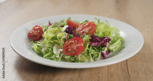 cherry tomatoes on salad leaves