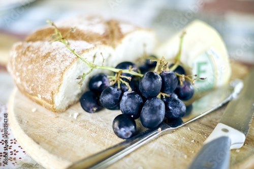 Rustic bread cheese and grapes