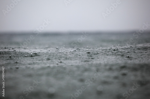 rain drops on the surface of the waves